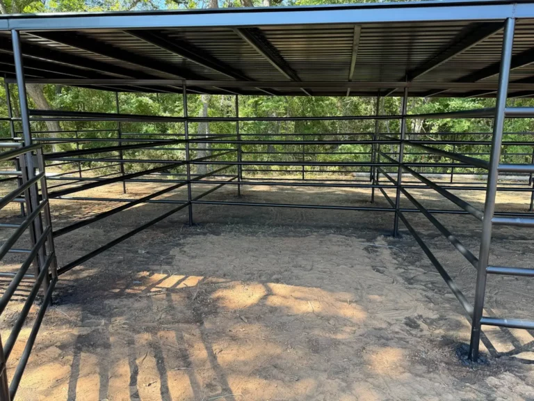 Inside a covered 12x12 horse stall with metal panel fencing