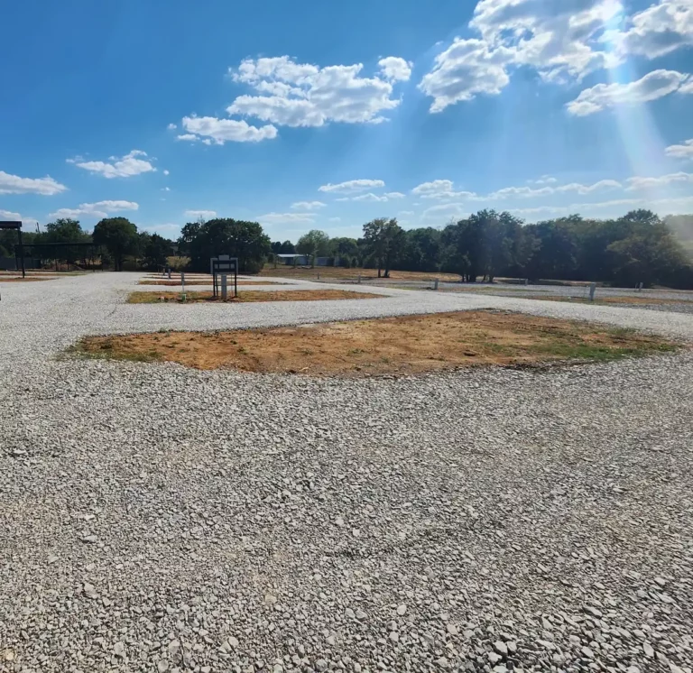 Wide gravel RV sites with full hookups at Longhorn Landing RV Park