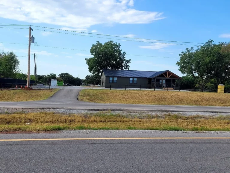 Longhorn Landing lodge and entrance drive seen from Hwy 70 in Lone Grove, OK