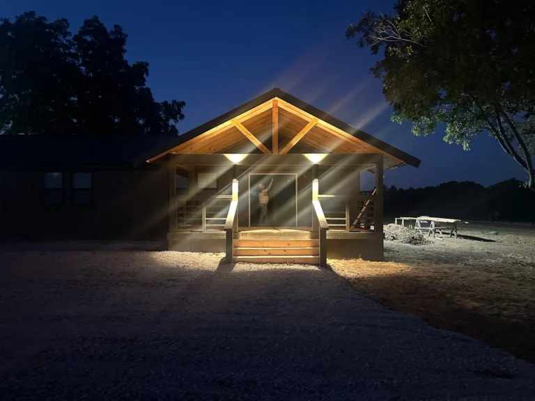 Longhorn Landing lodge porch lit up at night